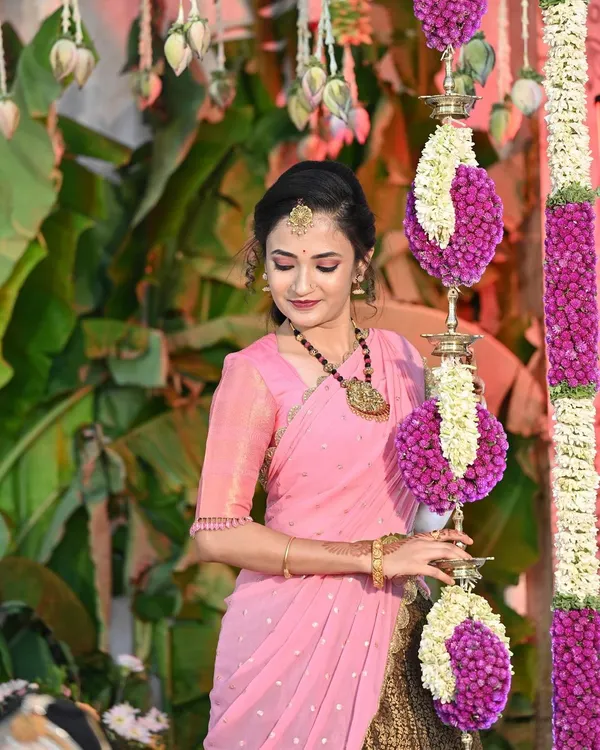 My beautiful client Gopika on her special day. She is glowing in a custom-designed two-tone lehenga, pairing a traditional brown brocade skirt with a lovely pink blouse and dupatta.