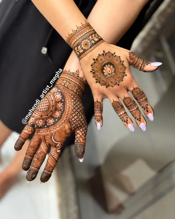 A beautiful example of a mixed-style design. One hand features a modern lotus mandala, while the other has a more traditional, dense pattern, showing how you can play with different looks.