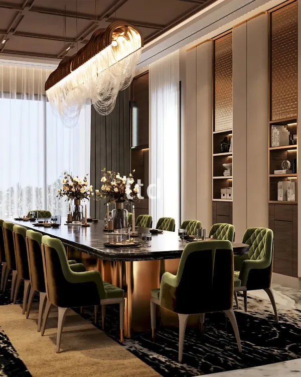 This dining area is conceived as a setting for shared moments and lasting memories. We composed this space with elegant olive-green seating and a magnificent lighting arrangement, creating a refined ambiance where a soft, luxe glow enhances the warmth and inviting charm for every gathering.
