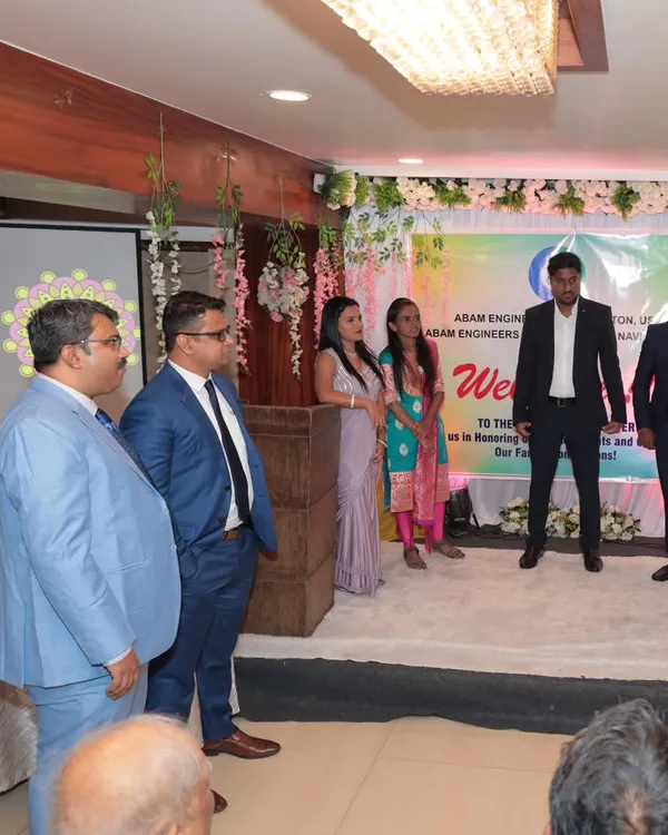 On stage during a formal corporate event for Abam Engineers. My role is to ensure the program flows seamlessly, from welcoming guests to introducing award winners.