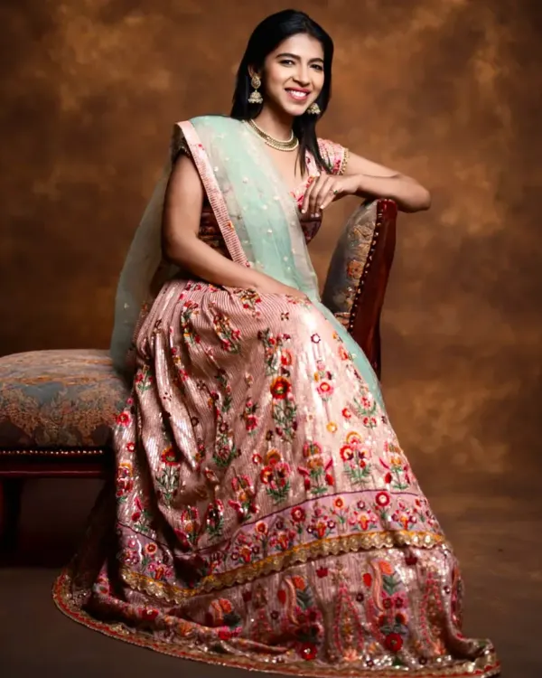 This gorgeous floral embroidered lehenga in shades of pink with a mint green dupatta is a client favorite for sangeet events or daytime weddings. It's light, happy, and incredibly photogenic.