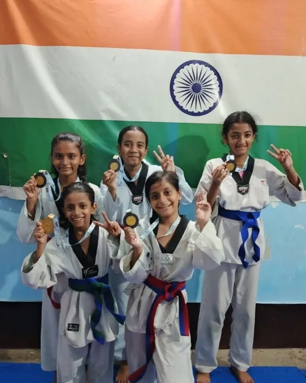 My students proudly showing their medals after the Taekwondo Asmita Khelo India women's league. This is the result of their hard work and dedication.