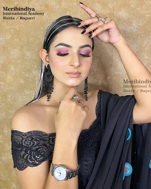 This celebrity-inspired look features a modern off-shoulder blouse and bold pink eyeshadow. It's a perfect example of the high-fashion looks we teach.