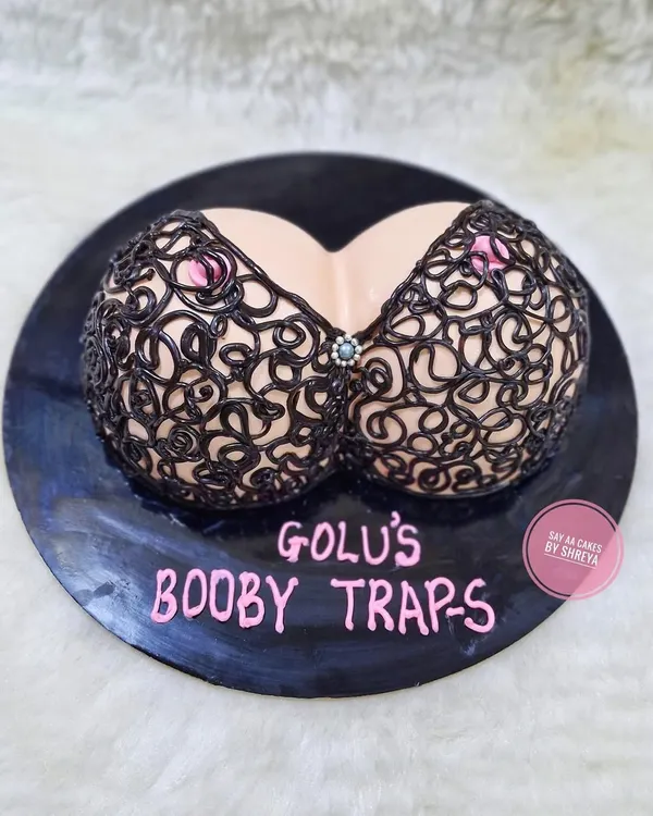 I believe celebrations should be fun and fearless, which is why I love making naughty bachelorette cakes. This "Booby Traps" design is a playful and popular choice for bridal showers, bringing a bit of cheeky humor to the party.