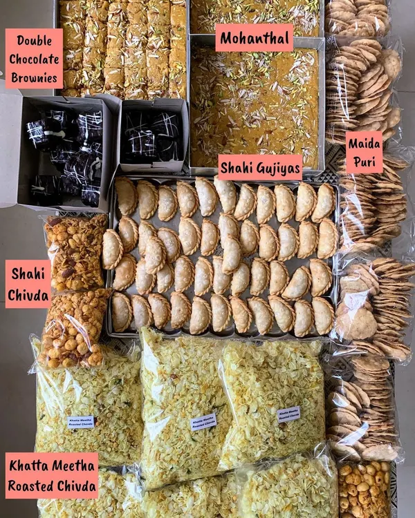 Getting ready for Raksha Bandhan with a spread of homemade sweets and snacks. This includes Double Chocolate Brownies, Mohanthal, Shahi Gujiyas, Shahi Chivda, and Maida Puri.