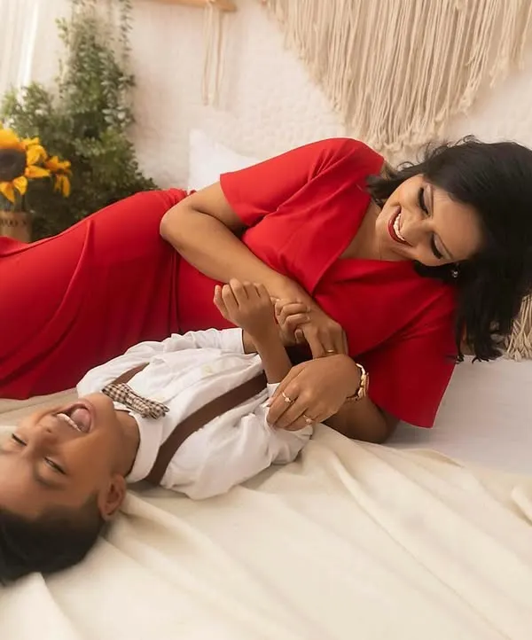 Capturing pure, uninhibited laughter is my favorite. This candid moment between a mother and her son during a lifestyle maternity session is filled with so much love and happiness.