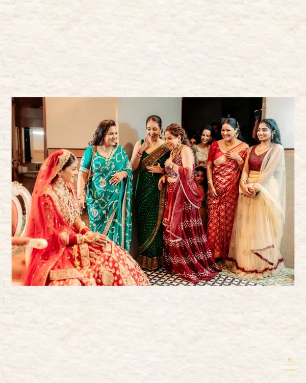 The bride sharing a moment of pure, uninhibited laughter with the women in her family. These are the candid, heartfelt moments that truly feel like home.