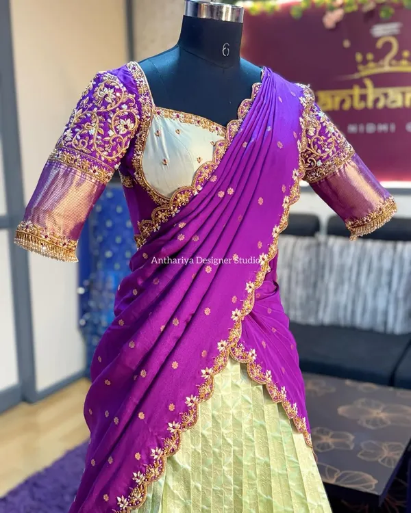 A mannequin shot of the light green and purple langa voni, focusing on the sweetheart neckline and embroidered blouse.