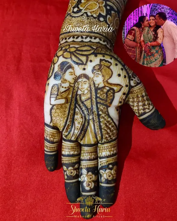 This design beautifully captures a cherished family moment, recreating a photograph of the bride with her parents directly into the palm of her hand.