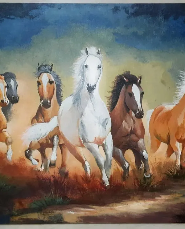 This is a large 1.5 by 2 feet acrylic painting of seven running horses, a powerful symbol in Vastu. I used bold colors and dynamic strokes to create a sense of energy and movement, making it a statement piece for any home.
