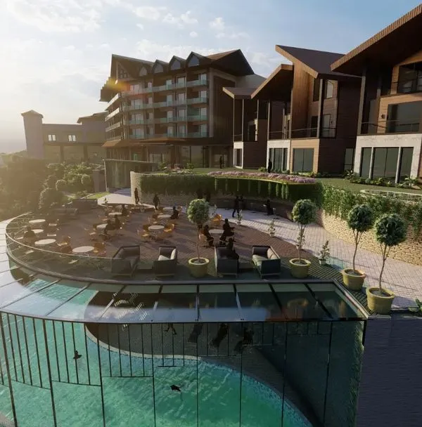 A render of an upcoming resort in Kufri, featuring an outdoor restaurant and a stunning glass-enclosed swimming pool. The design capitalizes on the location, offering guests mesmerizing views of the surrounding mountains.