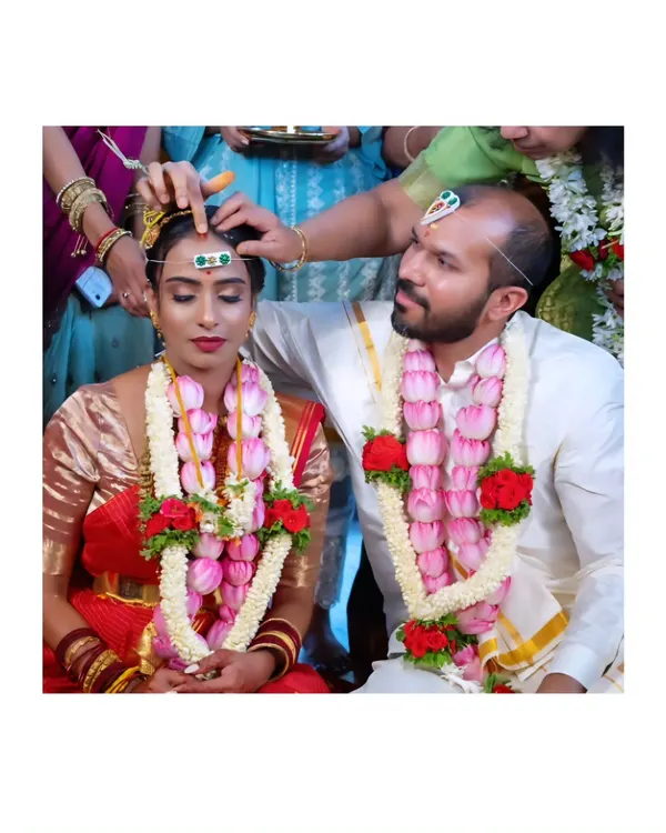 A key moment in a South Indian wedding ceremony. We focus on capturing the significant rituals with reverence and an eye for emotional detail, like this traditional blessing.
