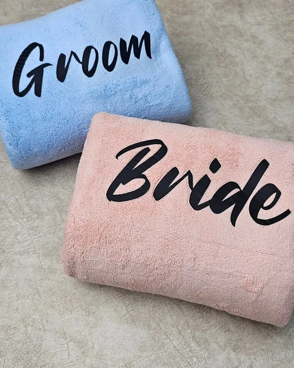 A perfect gift for newlyweds or a bridal shower. This set of soft towels is personalized for the "Bride" and "Groom" in a stylish font.