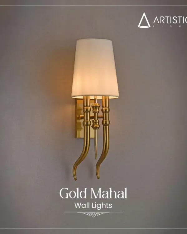My 'Gold Mahal' wall light is designed to bring a royal touch to your interiors. It features gracefully curved arms in a gold finish and a classic fabric shade that provides a soft, warm illumination.
