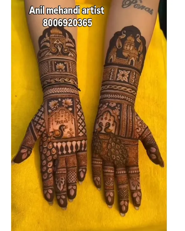 This is the kind of intricate bridal mehandi I specialize in. Notice the fine details, including the shaded peacock on one palm and the palace architecture on the forearm, creating a complete story for the bride's big day.