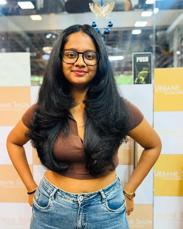 A perfect example of our layered haircut, styled with an inward curl to create volume and a beautifully framed face. This is a classic, stylish look.