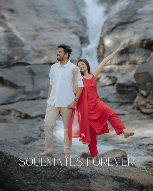 Soulmates forever, framed by the raw beauty of nature. A playful and joyful shot of the couple at a waterfall, capturing their fun-loving spirit.