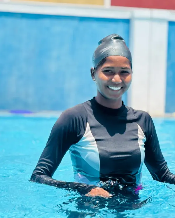 A portrait of one of our dedicated swimmers, confident and ready for her training session in the pool.