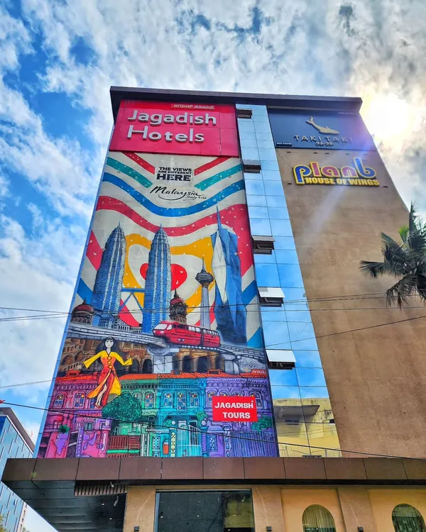 This was one of our biggest projects, a 100-foot mural for Malaysia Tourism in the heart of Bengaluru. We transformed a whole building facade into a vibrant showcase of the country's landmarks, including the Petronas Towers.