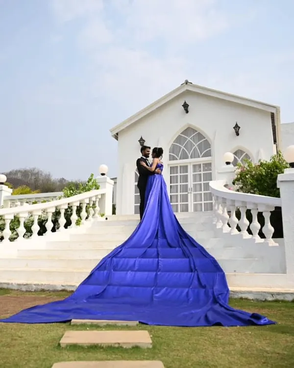 The definition of royal. This royal blue gown with its extra-long quilted trail creates a grand and majestic statement, perfect for a pre-wedding shoot at a palace or stately home.
