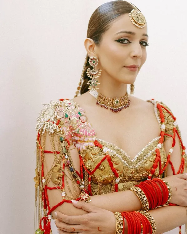 For bride Shweta Kapur's Mehendi, I created a look that was both traditional and avant-garde. The sharp, winged eyeliner and flawless skin provided a modern contrast to her intricate heritage-inspired outfit and jewelry.