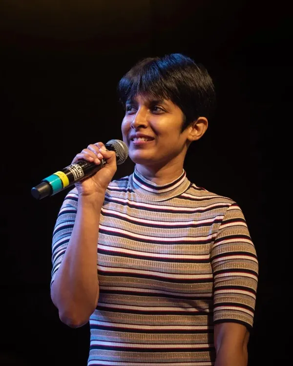 This is me in my element, on stage with a microphone. I believe in creating a calm and natural flow for any event, ensuring the spotlight remains on the moment and the message, not on the host. My goal is to connect with the audience through a steady, warm presence.