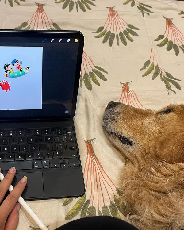 This is my typical workspace: me on my bed, sketching on my tablet, with my dog and chief creative officer right by my side. My process is all about comfort and creativity.