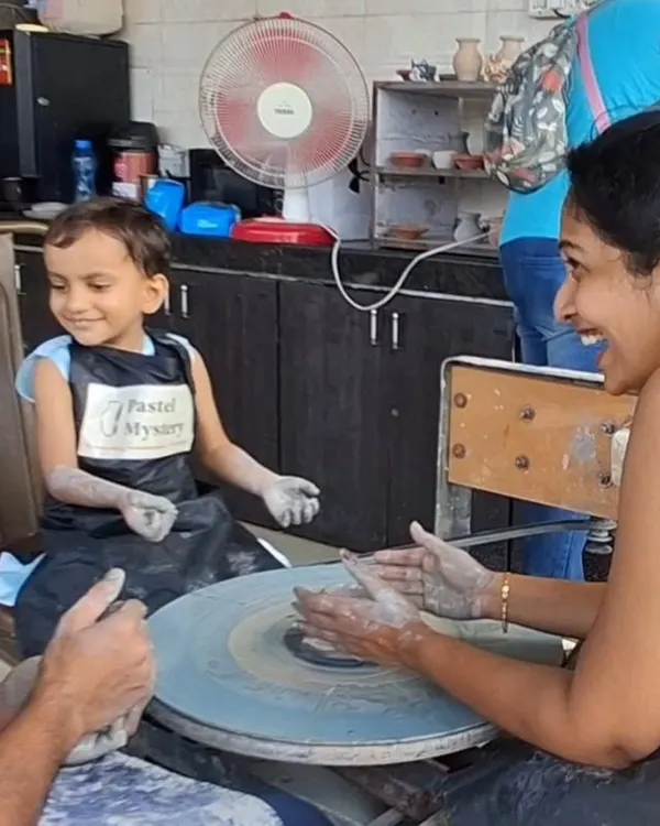 This smile says it all. There's nothing like the feeling of clay spinning under your hands for the first time. I make sure every child feels the magic of the potter's wheel in a fun and supportive way.