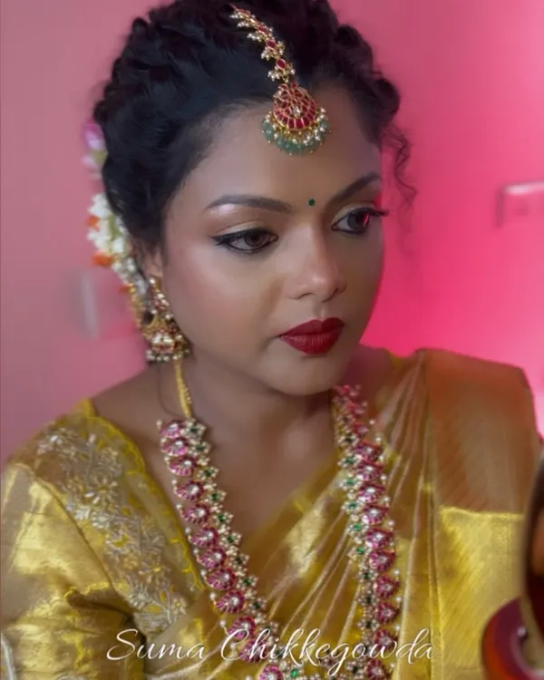 The final look on my beautiful client Swati. Here you can see the flawless base, sharp winged liner, and bold red lip, all coming together for a stunning traditional look.