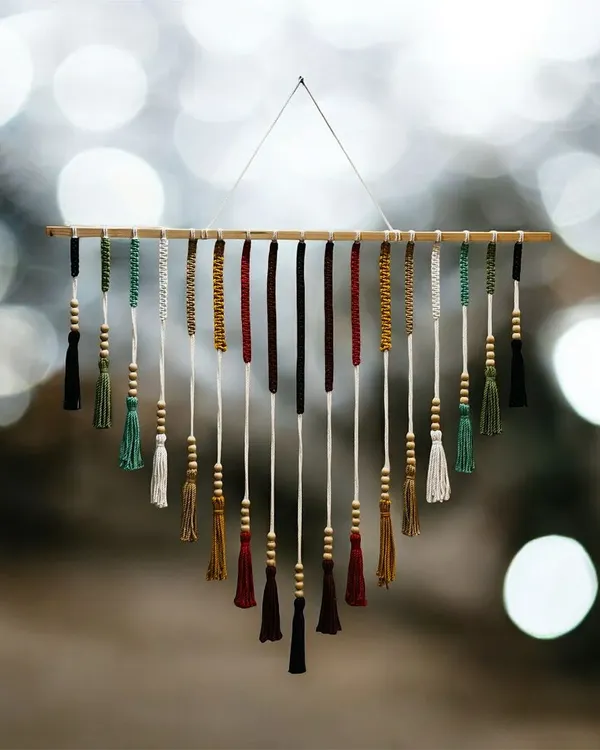 This is one of my favorite wall hangings, and it truly captures the bohemian spirit of my craft. The rich, earthy tones and delicate wooden beads create a stunning V-shape tassel design that brings warmth and texture to any wall. It’s a perfect statement piece for a living room or bedroom.