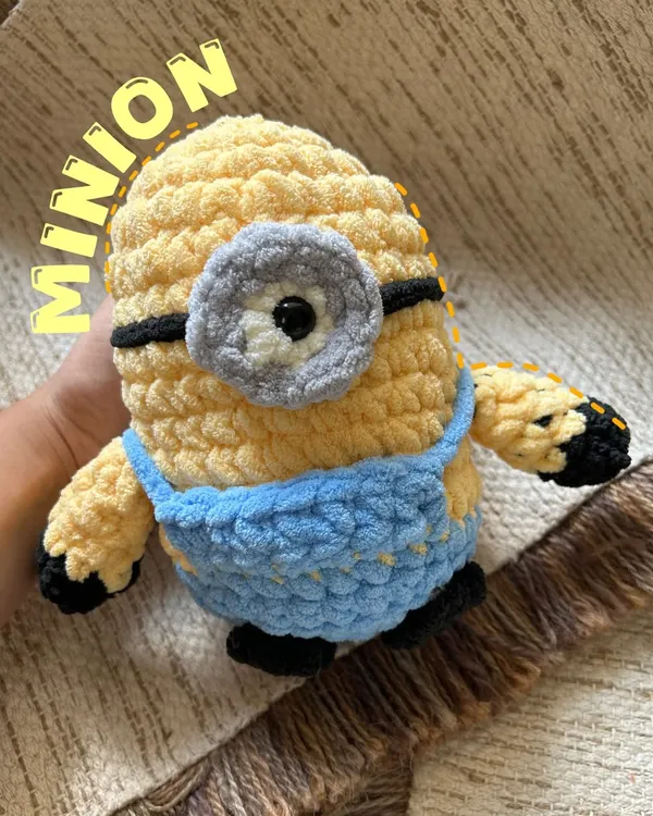 "Bello!" This chunky yarn Minion is ready for mischief and cuddles. We used premium, extra-soft yarn to make him incredibly huggable. His goggle and overalls are stitched with care, making him a durable and lovable friend for fans of all ages.
