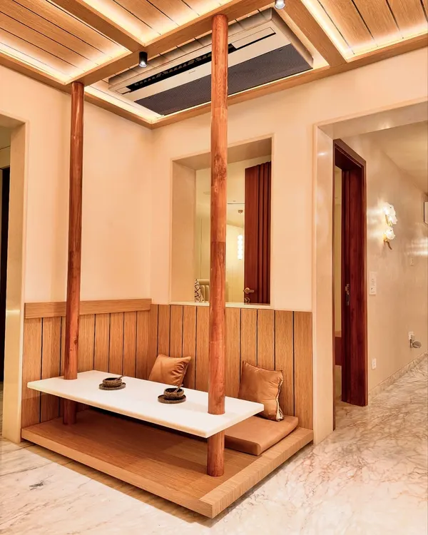 A closer look at the suspended dining bench, a feature I designed to be both functional and artistic. The solid wood posts anchor the floating table, creating a unique focal point in this Zen-inspired home.