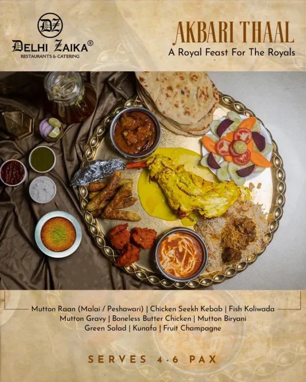 This is our Akbari Thaal, a royal feast designed for sharing. It’s a grand platter featuring a selection of our finest dishes, from succulent Mutton Raan and Boneless Butter Chicken to fragrant Mutton Biryani and an assortment of kebabs, all served with fresh naan and salad.