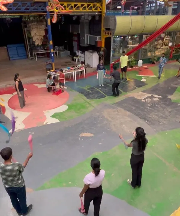 This is a typical scene from one of my workshops. You can see everyone spread out, practicing with different props like poi and juggling clubs at their own pace. It's a very hands on and relaxed learning environment.