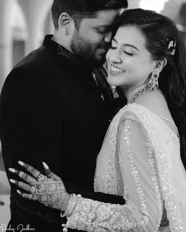 A moment of pure joy. This black and white close-up of Swati's laugh during her engagement captures an unscripted, beautiful emotion that color would only distract from.