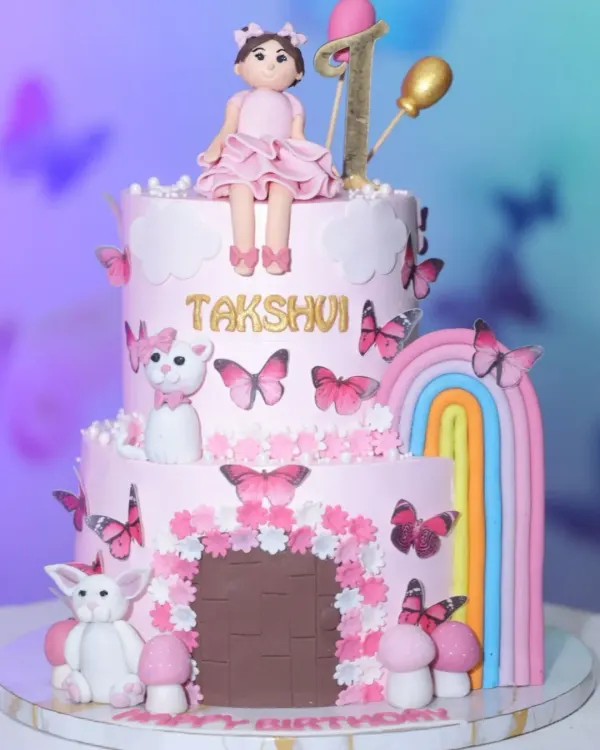 This two-tier butterfly and rainbow cake is a perfect example of how I bring dream designs to life. It features a fresh pineapple flavor, delicate fondant work, and a beautiful pastel rainbow, making it a magical centerpiece for a first birthday.