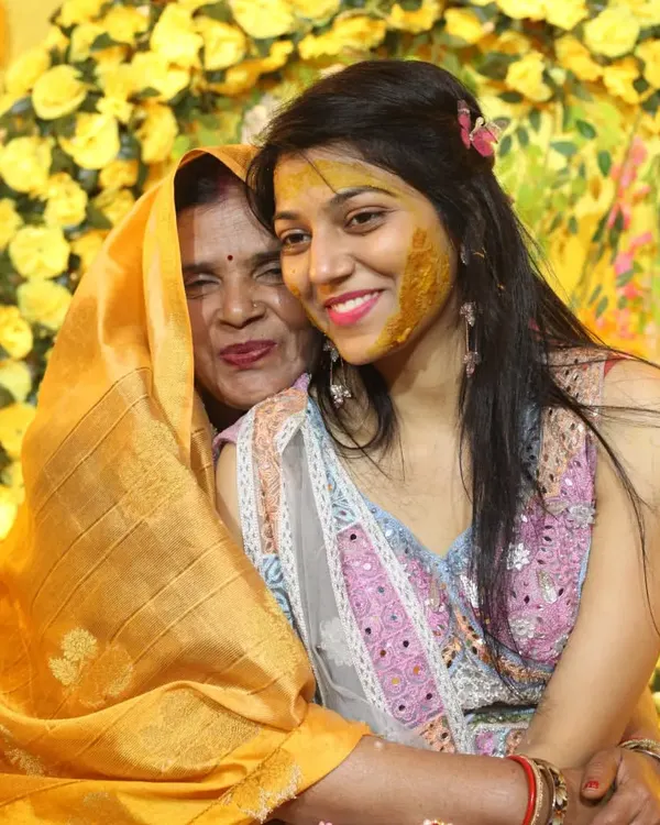 An emotional hug between the bride and her mother during the Haldi ceremony. These are the priceless, heartfelt moments we strive to preserve for you through our candid photography.