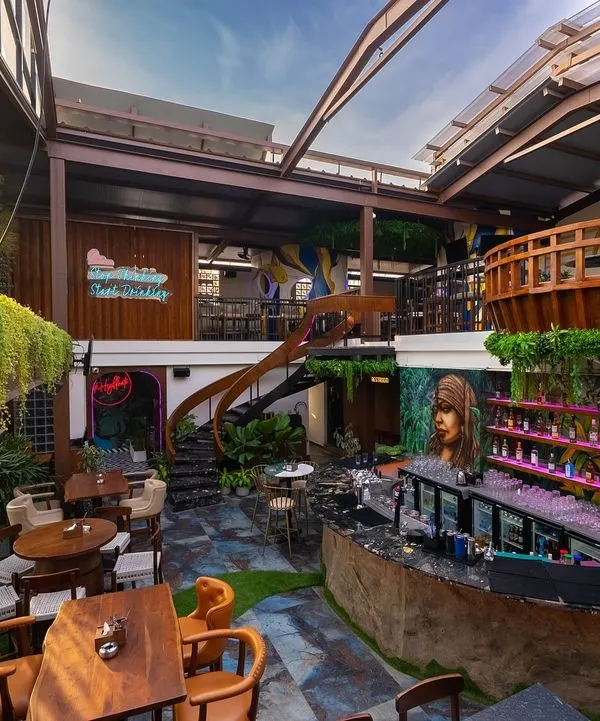 This multi-level restobar captures our passion for creating dynamic, nature-infused spaces. We designed this venue with a retractable roof, lush hanging greenery, and unique lighting to craft an unforgettable hospitality experience, day or night.