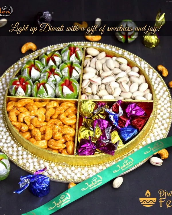 This is the essence of festive gifting. Our signature round tray is artfully divided to hold an assortment of premium roasted cashews and pistachios, decadent handmade chocolates, and traditional Indian sweets, all tied together with our branded ribbon.