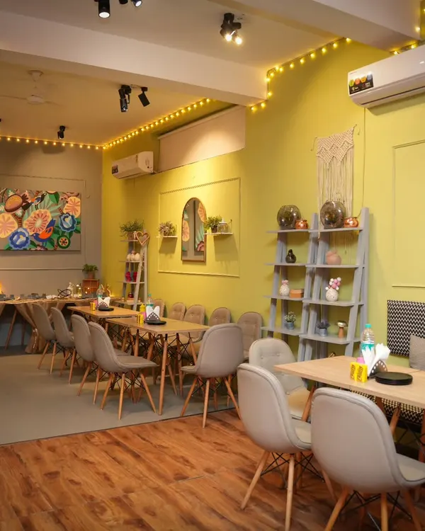 I welcome you all to a cozy space for making memories together. This is the cafe area where adults can relax and socialize.