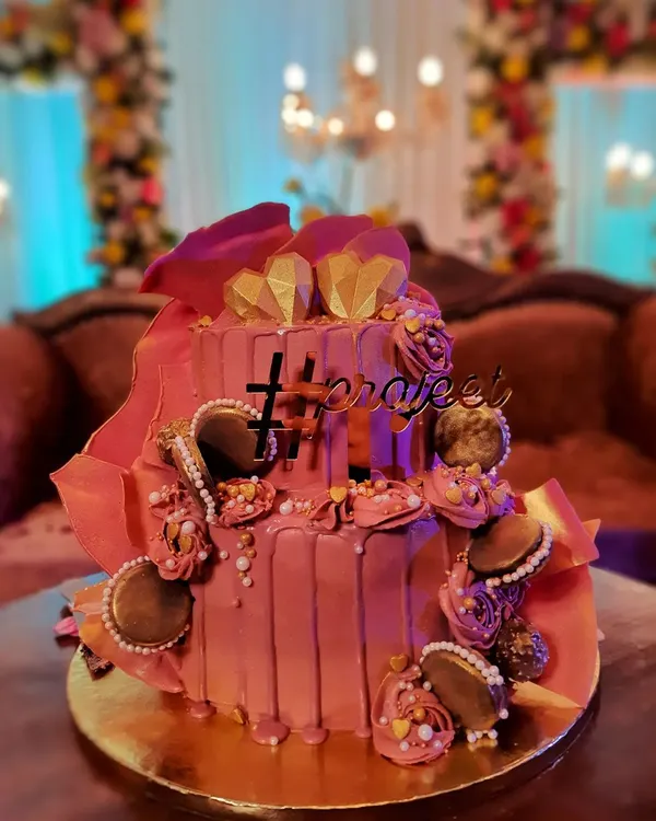 This two-tiered beauty was for a wedding, and I was so honored to be a part of their special day. I love creating elegant cakes like this, with custom hashtags and delicate details, to make your celebration unforgettable.