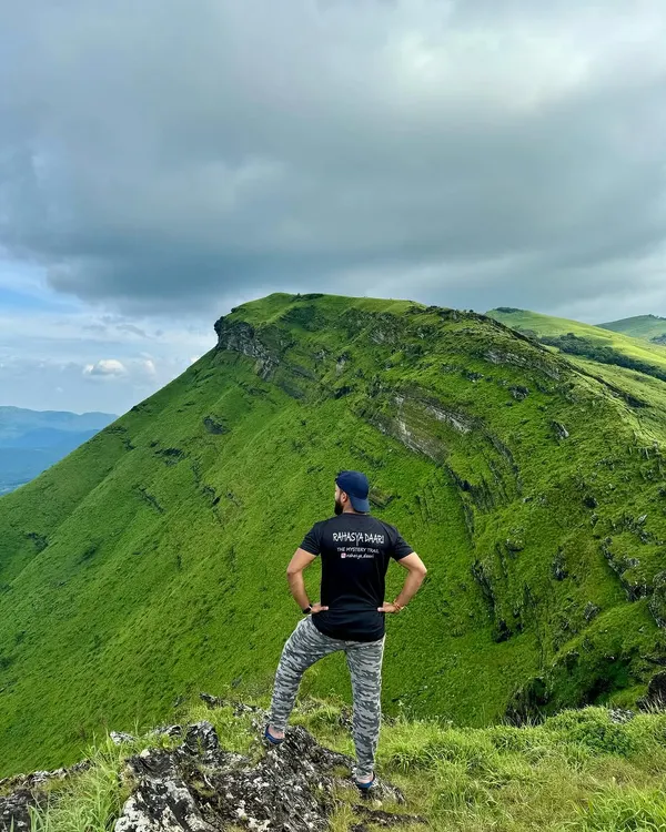 Taking in the stunning ridge-line view from Z-point in Kemmangundi. This is a highlight of my "Explore Chikmagalur" itinerary, perfect for groups who love panoramic mountain vistas.