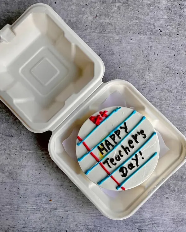A creative bento cake for Teacher's Day, designed to look like a ruled notebook page. It's a sweet and thoughtful way to say thank you to a mentor.