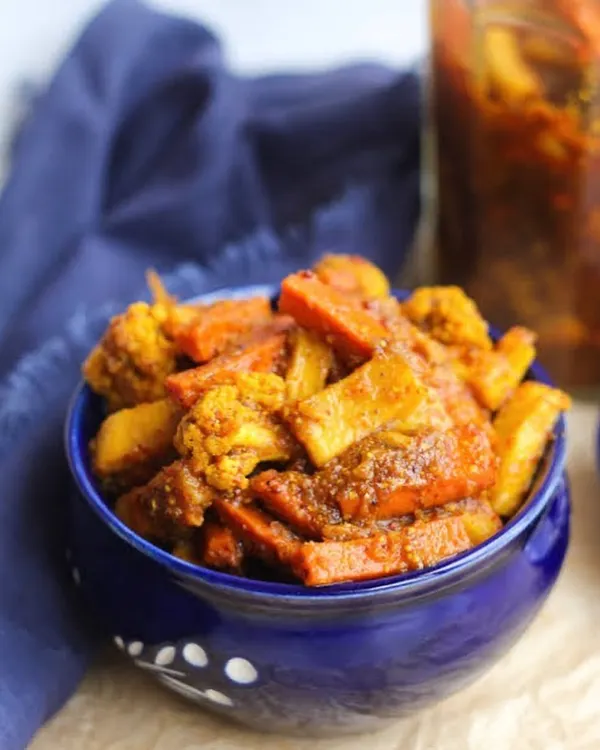 A bowl of my fresh Khatta Meetha Gobi Gajar Shalgam pickle. I offer this winter favourite in two versions, one made with sugar and another with jaggery for a more traditional taste.