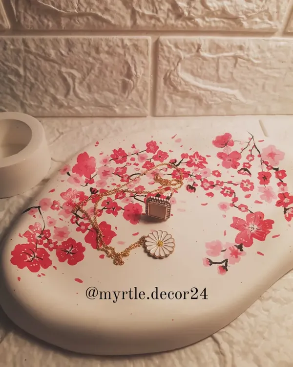 The urge to paint on any empty surface is real. Here is a plain white cloud tray that we transformed with a hand-painted cherry blossom design. We love turning simple pieces into works of art.