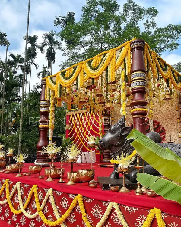 This is the kind of grand, traditional South Indian wedding mandap I love to create. The rich red and gold tones, intricate pillars, and abundant floral work with marigolds and tuberoses come together to form a truly sacred and beautiful space for a wedding ceremony.
