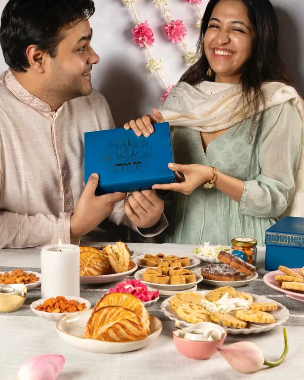 The perfect Rakhi or Bhai Dooj moment, sharing a beautifully designed Meetha Maska Diwali gift box. Our hampers are made for creating and sharing sweet memories with your loved ones.