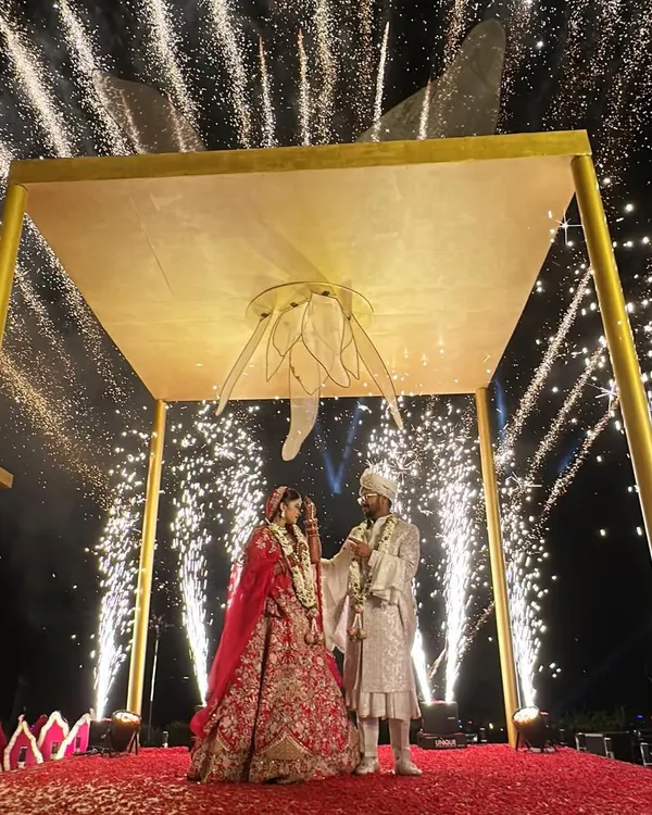 This is what fairytales are made of. A magical varmala moment under a shower of sparks, set within our custom 'Kamal Palace' mandap for a spectacular beach wedding in Goa.
