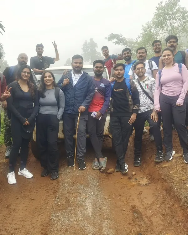 Our group with the 4x4 jeep that takes us on a thrilling off-road journey to the Kodachadri peak. It's a key part of the adventure.