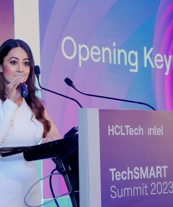Addressing the audience at the TechSMART Summit for HCL and Intel. I am adept at hosting formal corporate events, delivering opening keynotes, and moderating panels with professionalism.